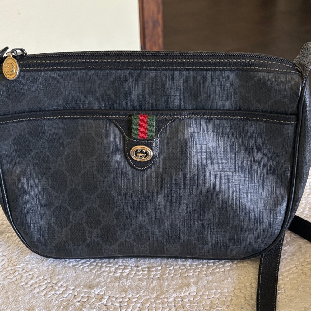 Gucci Black Shoulder Bag with Gold Emblem. Authentic